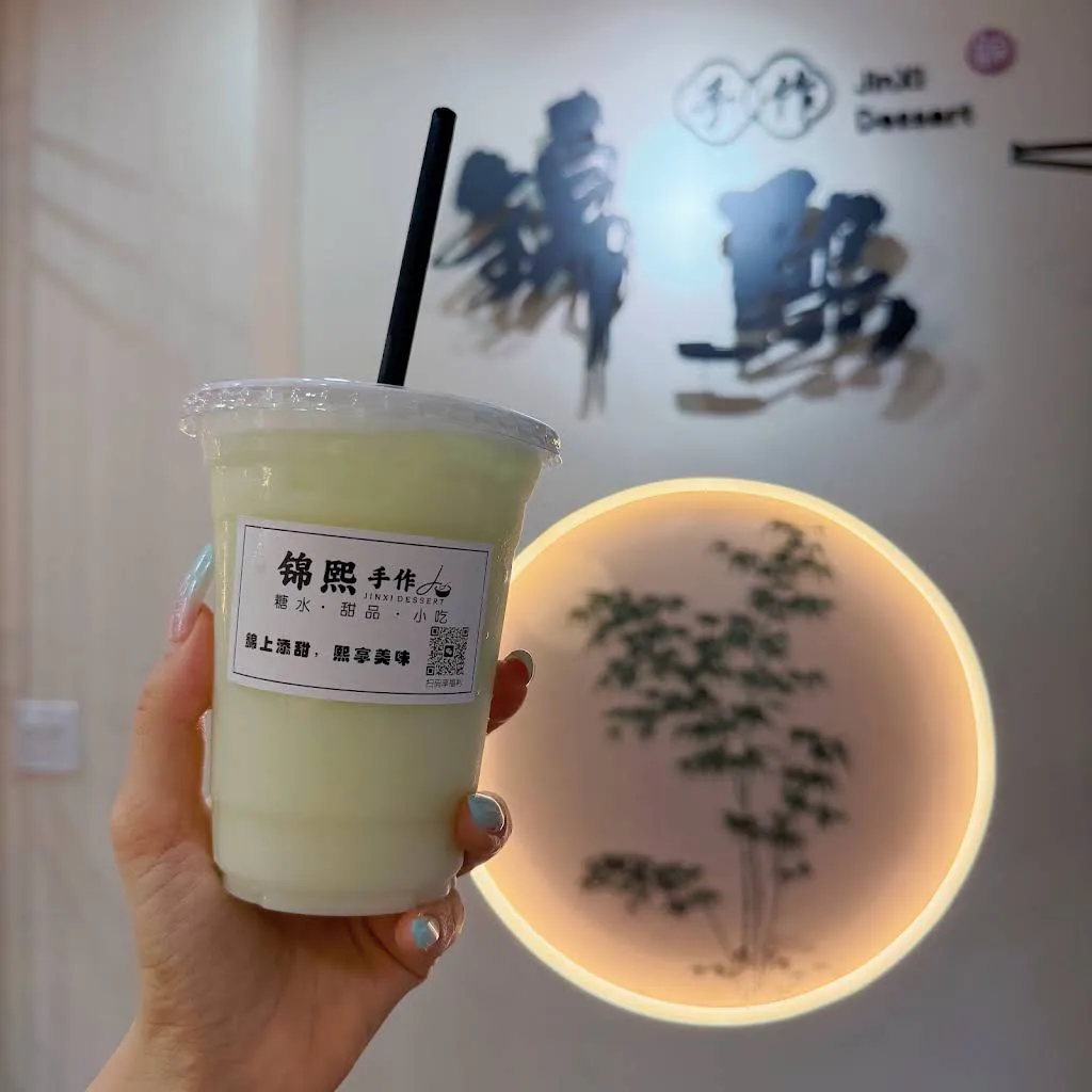Light green creamy milkshake in plastic cup